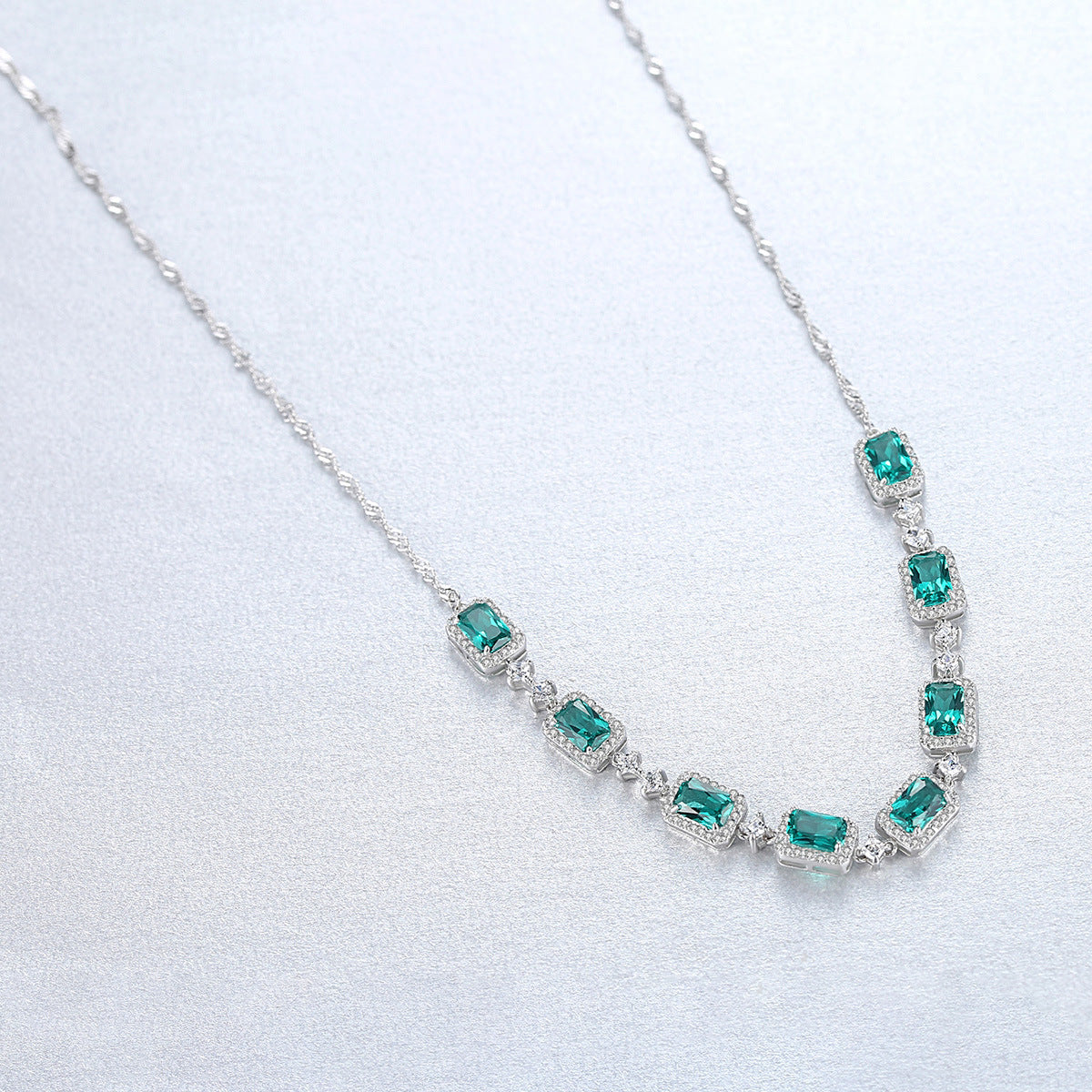 Gemstonely- S925 Silver Necklace Set with Wave Chain and  Imitation Emerald